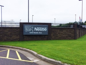 industrial production site stone fence and sign